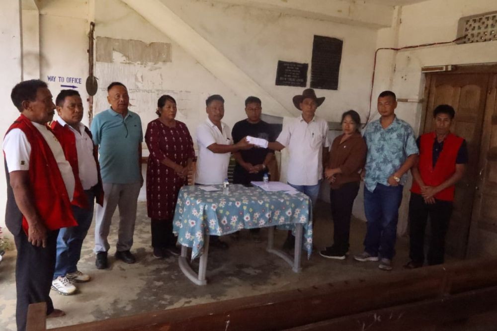 KU official hands over the relief during a visit to Aboi in Mon on July 30.